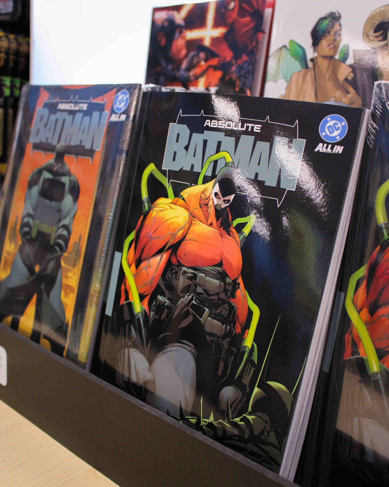 Comic book display featuring the famous absolute batman volumes 1 and 2, hardcover and regular cover. Buy absolute batman comics in greenville at planet comics.