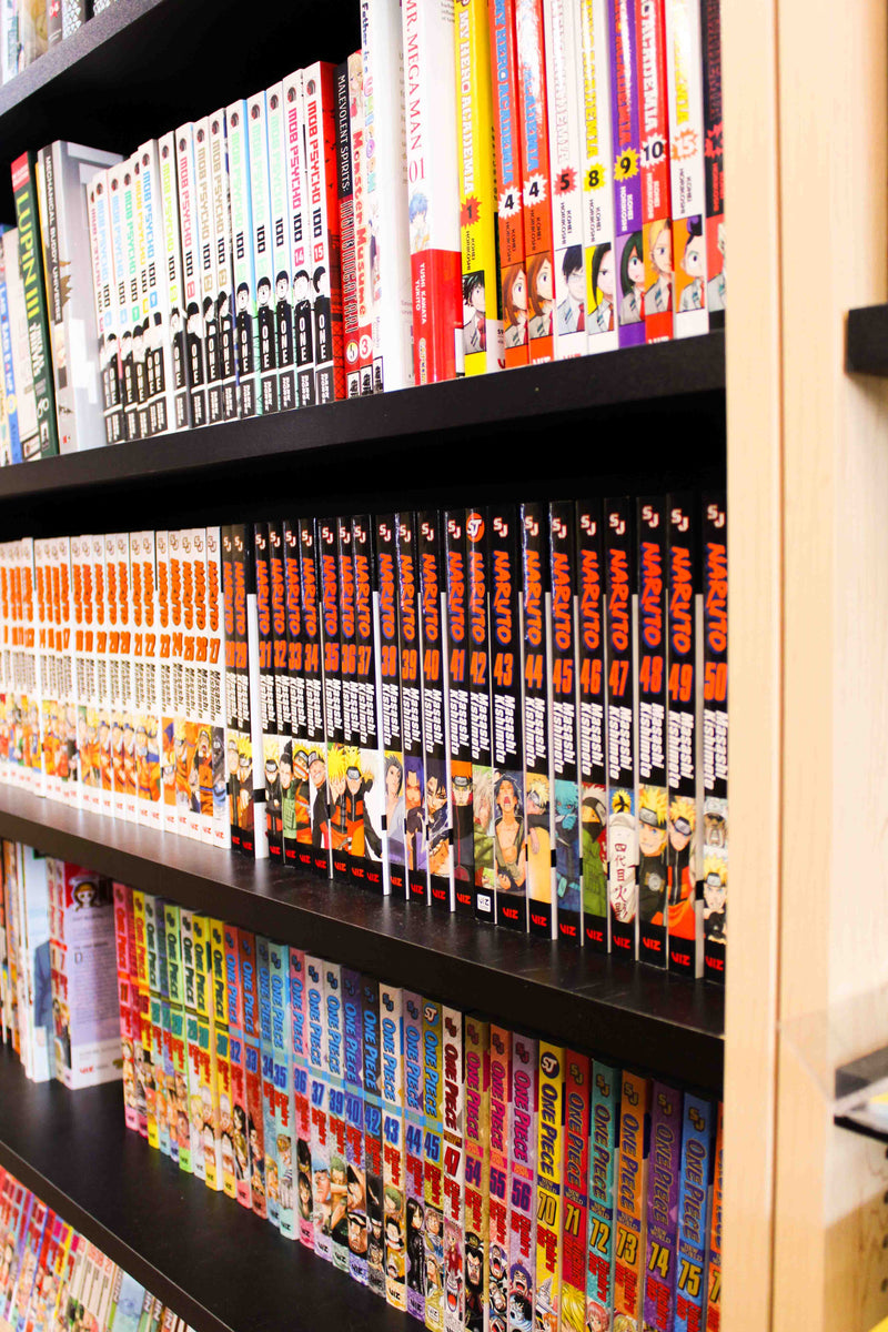 Shelves filled with manga books from various popular manga collections. Many mangas from hit anime series like Naruto, One Piece, and My Hero Academia.