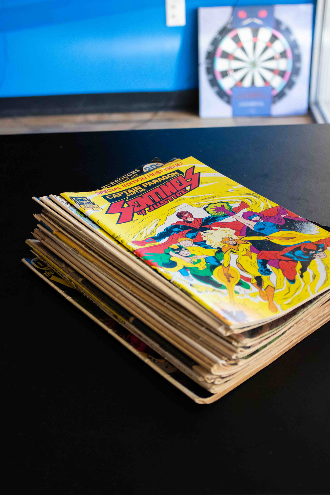 stack of old comic books that were bought by Planet Comics. Sell used comic books at Planet Comics.